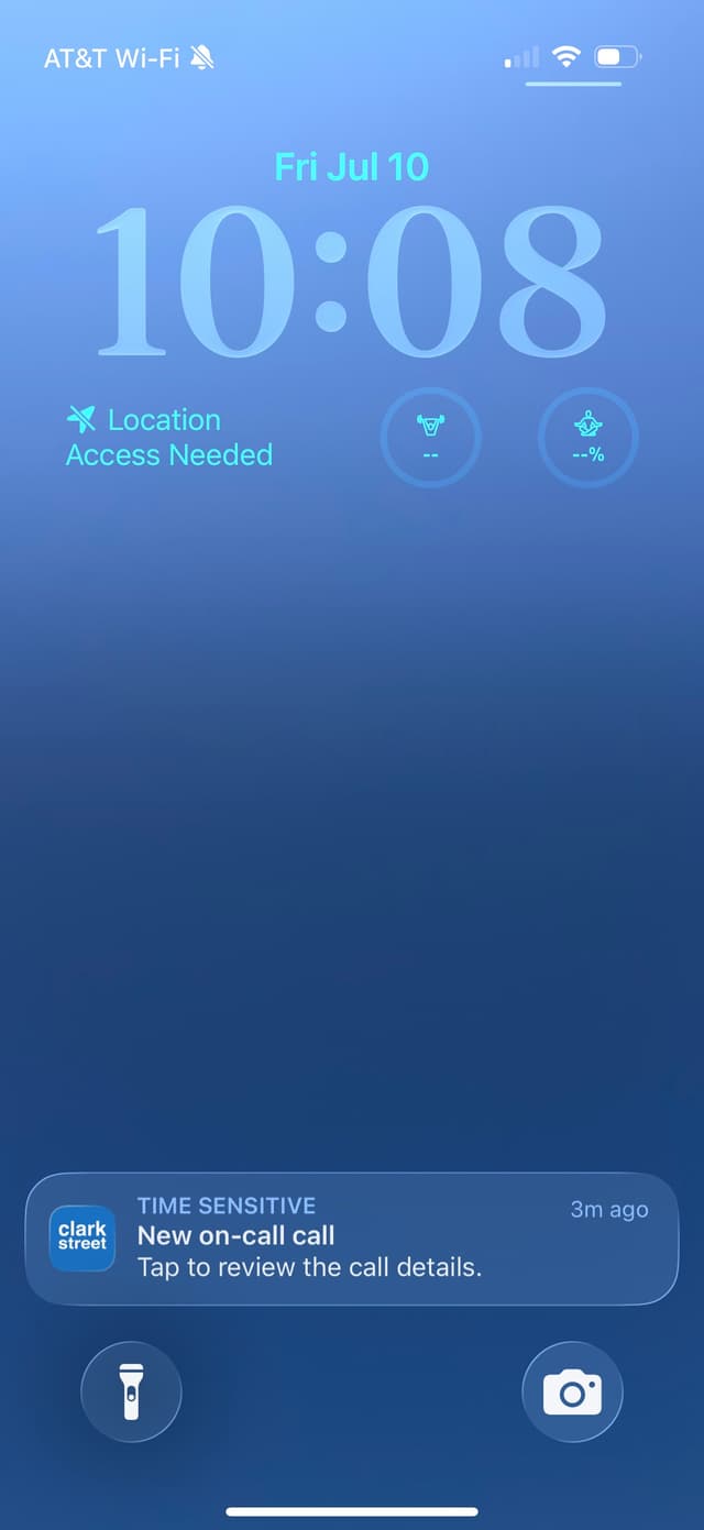 iPhone lock screen showing a Time Sensitive Clark Street notification for a new on-call call